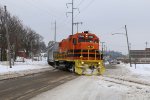 Crossing the slushy Taylor Ave, 2104 nears Ann St Yard